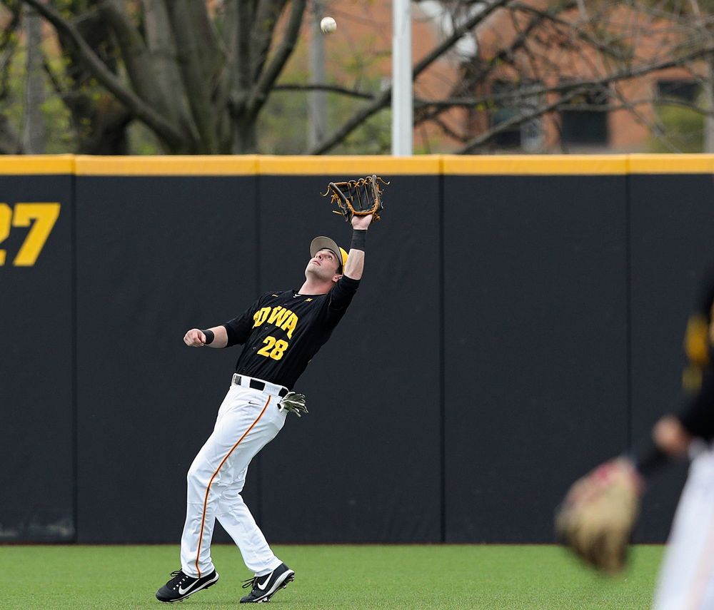Iowa Hawkeyes left fielder Chris Whelan (28) pulls in a fly ball for an out during the first inning of their game against Western Illinois at Duane Banks Field in Iowa City on Wednesday, May. 1, 2019. (Stephen Mally/hawkeyesports.com)
