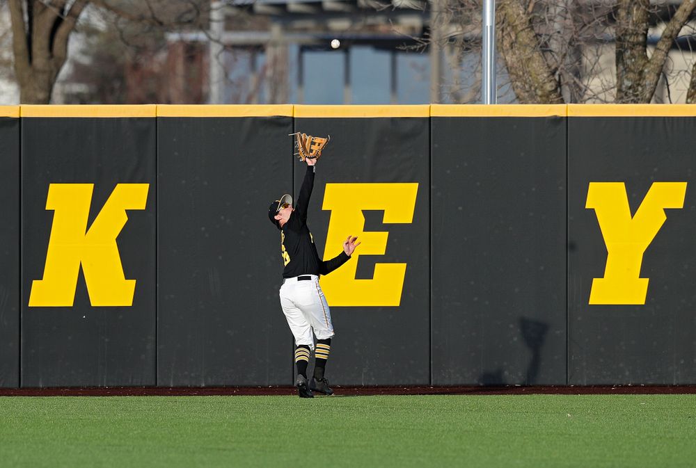 Iowa outfielder Justin Jenkins (6) runs down a fly ball for an out during the sixth inning of their college baseball game at Duane Banks Field in Iowa City on Tuesday, March 10, 2020. (Stephen Mally/hawkeyesports.com)