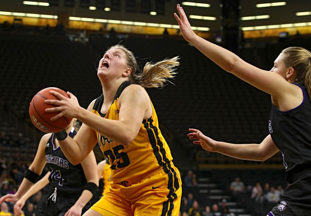 Iowa forward/center Monika Czinano (25) makes a basket during the fourth quarter of their game against Winona State at Carver-Hawkeye Arena in Iowa City on Sunday, Nov 3, 2019. (Stephen Mally/hawkeyesports.com)