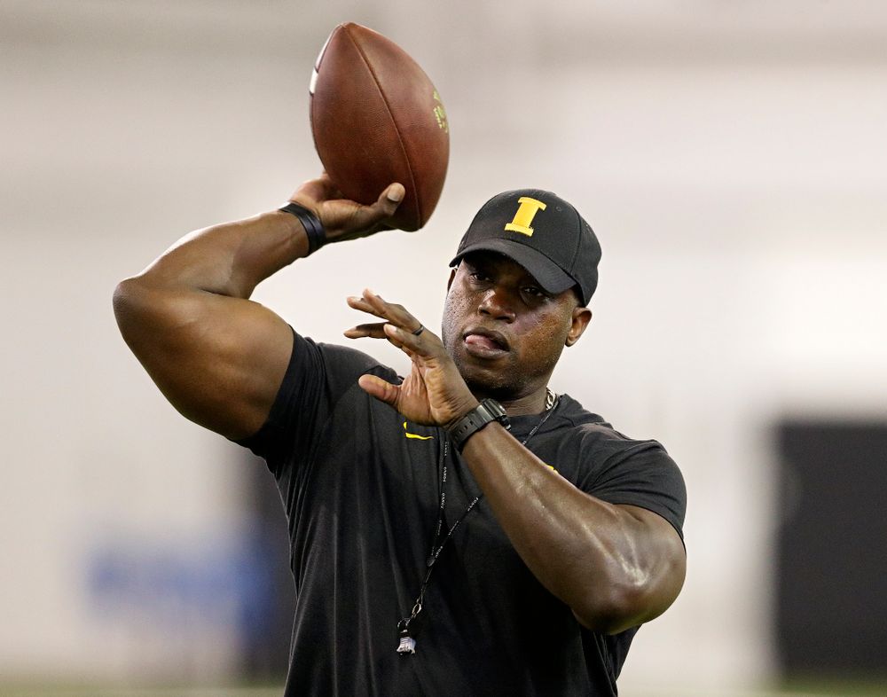 Iowa Hawkeyes wide receivers coach Kelton Copeland throws a pass during Fall Camp Practice No. 9 at the Hansen Football Performance Center in Iowa City on Monday, Aug 12, 2019. (Stephen Mally/hawkeyesports.com)