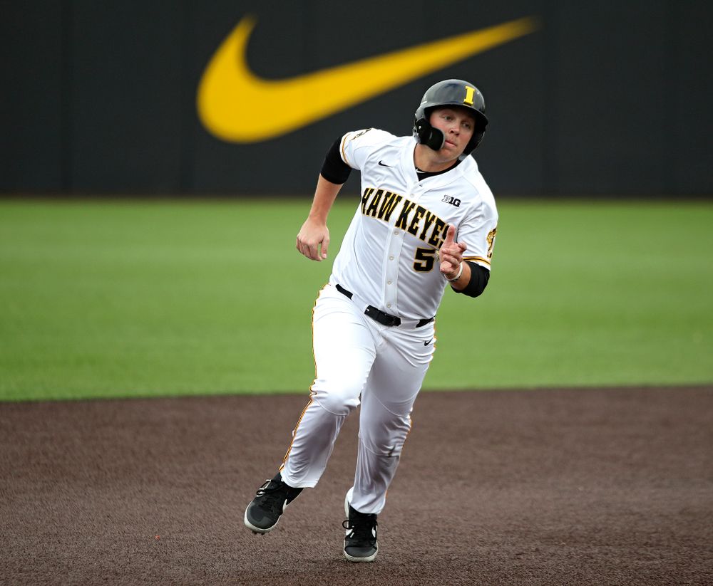 Iowa outfielder Zeb Adreon (5) runs between second and third base during the fourth inning of their college baseball game at Duane Banks Field in Iowa City on Wednesday, March 11, 2020. (Stephen Mally/hawkeyesports.com)