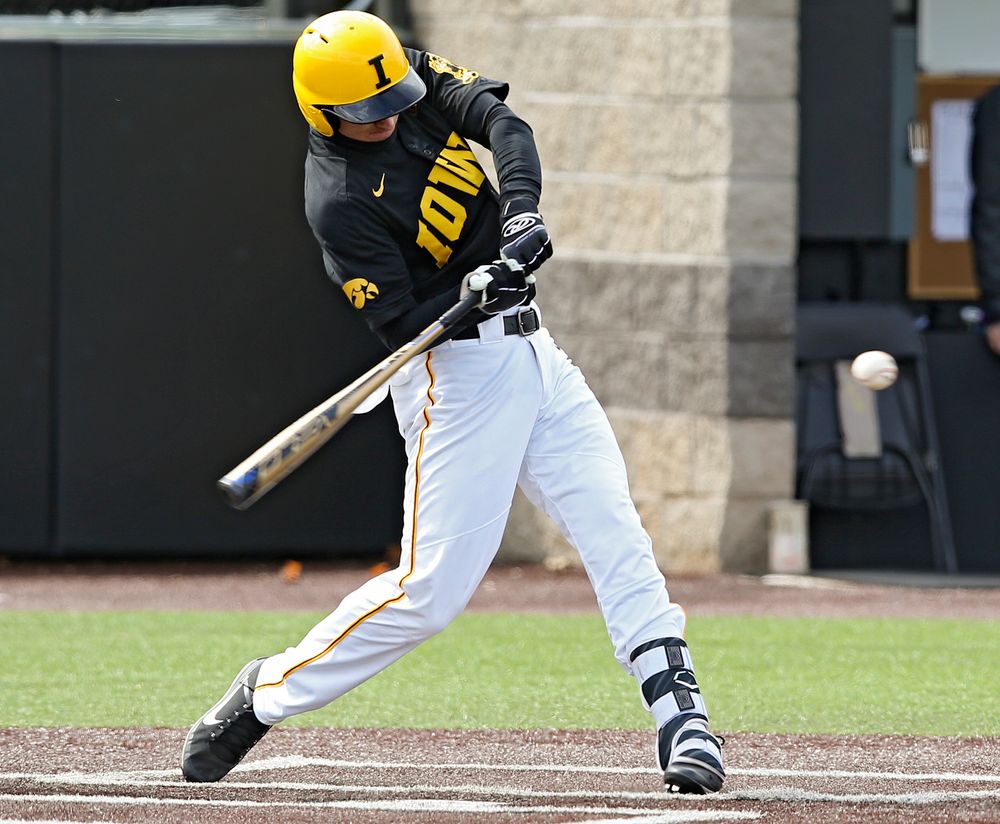 Iowa Hawkeyes shortstop Tanner Wetrich (16) with a 2-RBI single during the second inning of their game against Illinois at Duane Banks Field in Iowa City on Saturday, Mar. 30, 2019. (Stephen Mally/hawkeyesports.com)