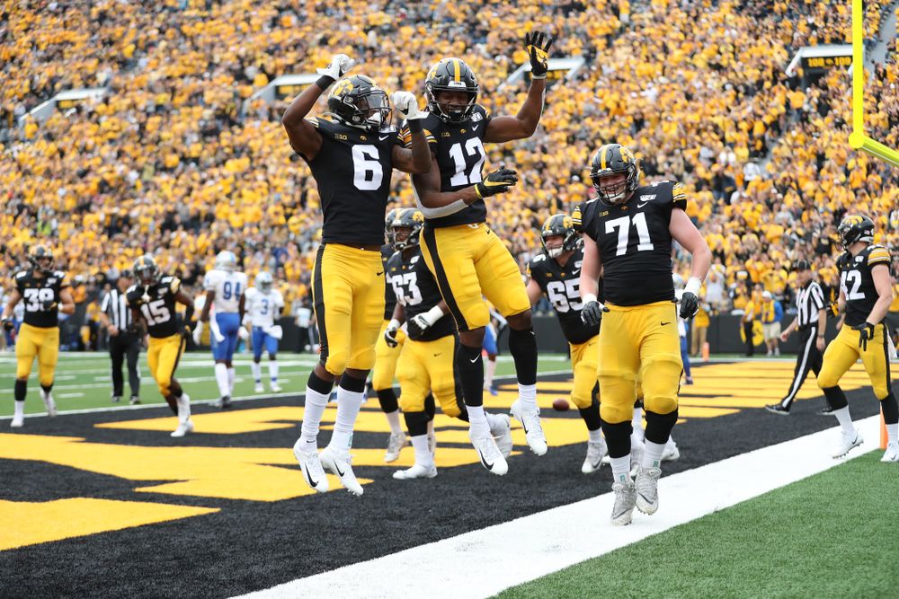 Iowa Hawkeyes wide receiver Brandon Smith (12) celebrates with wide receiver Ihmir Smith-Marsette (6) against Middle Tennessee State Saturday, September 28, 2019 at Kinnick Stadium. (Max Allen/hawkeyesports.com)