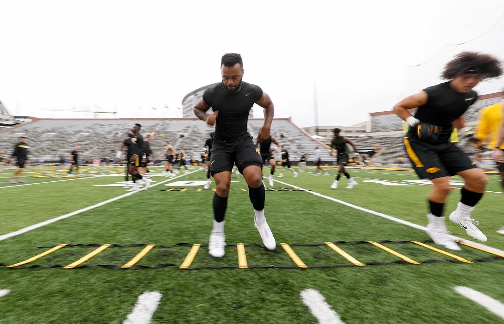 Iowa Hawkeyes linebacker Djimon Colbert (32) warms up with his teammates before their game at Kinnick Stadium in Iowa City on Saturday, Sep 28, 2019. (Stephen Mally/hawkeyesports.com)