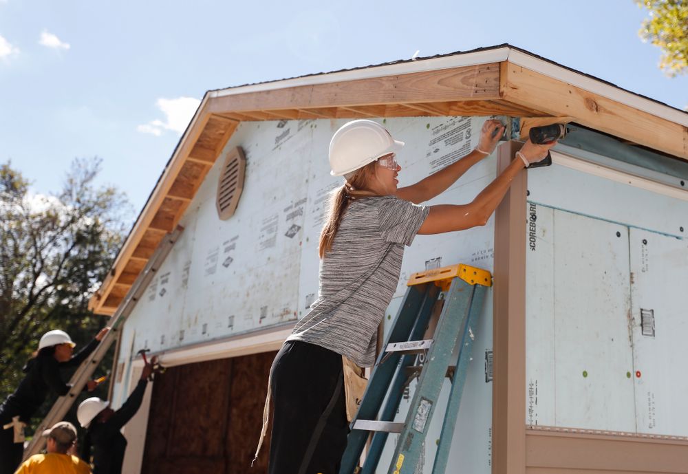Iowa Hawkeyes forward Logan Cook (23) works on the Habitat for Humanity Women's Build Wednesday, September 26, 2018 in Iowa City. (Brian Ray/hawkeyesports.com)