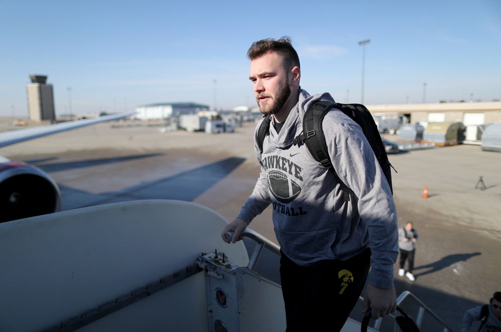 Iowa Hawkeyes punter Colten Rastetter (7) boards the team plane at the Eastern Iowa Airport Saturday, December 21, 2019 on the way to San Diego, CA for the Holiday Bowl. (Brian Ray/hawkeyesports.com)