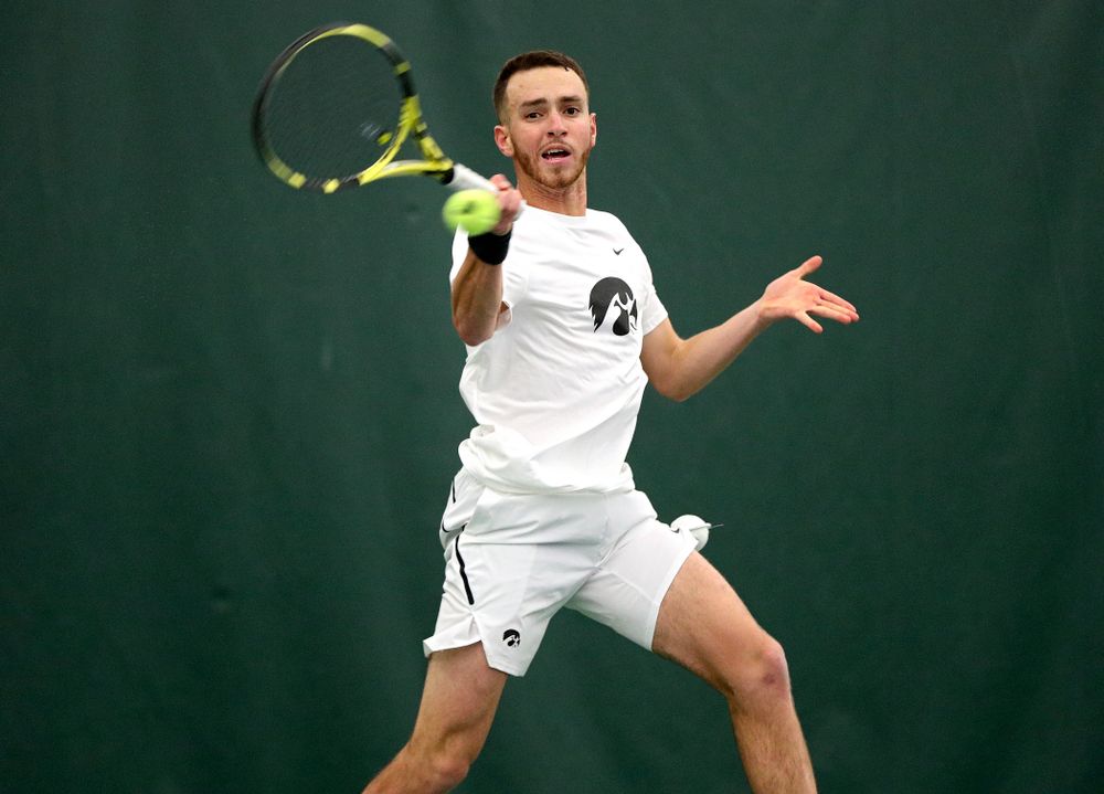 Iowa’s Kareem Allaf returns a shot during his singles match at the Hawkeye Tennis and Recreation Complex in Iowa City on Sunday, February 16, 2020. (Stephen Mally/hawkeyesports.com)