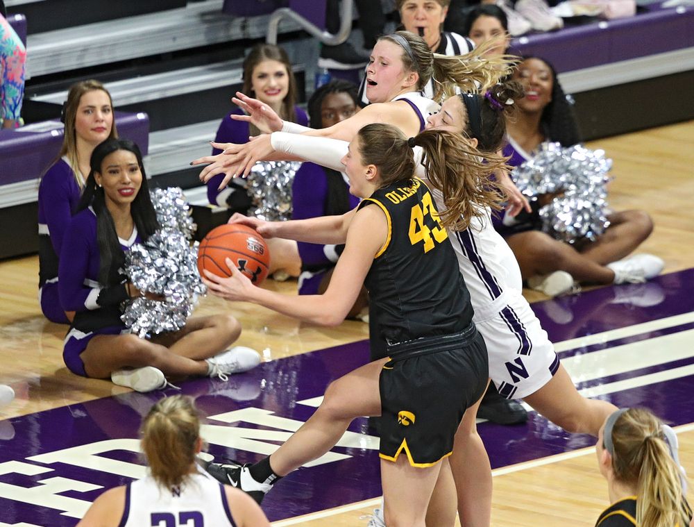 Iowa Hawkeyes forward Amanda Ollinger (43) pulls in a rebound during the fourth quarter of their game at Welsh-Ryan Arena in Evanston, Ill. on Sunday, January 5, 2020. (Stephen Mally/hawkeyesports.com)