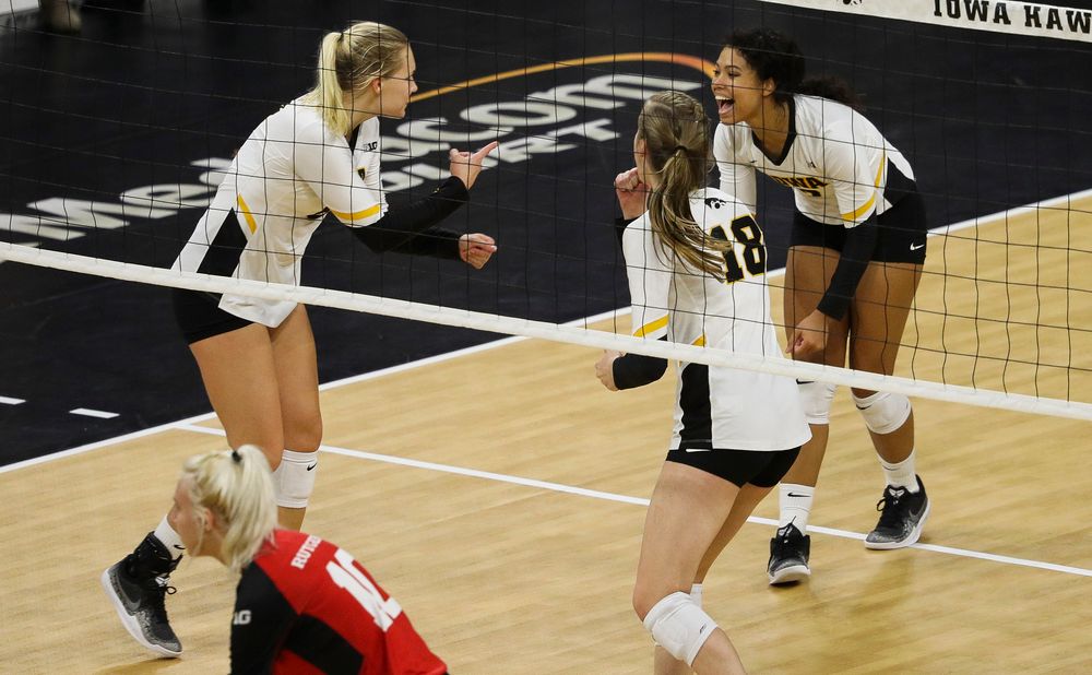 Iowa Hawkeyes right side hitter Reghan Coyle (8) and Iowa Hawkeyes setter Brie Orr (7) celebrate after winning a point during a match against Rutgers at Carver-Hawkeye Arena on November 2, 2018. (Tork Mason/hawkeyesports.com)