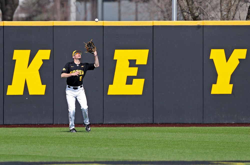 Iowa Hawkeyes center fielder Ben Norman (9) pulls in a fly ball for an out during the fifth inning of their game against Rutgers at Duane Banks Field in Iowa City on Saturday, Apr. 6, 2019. (Stephen Mally/hawkeyesports.com)