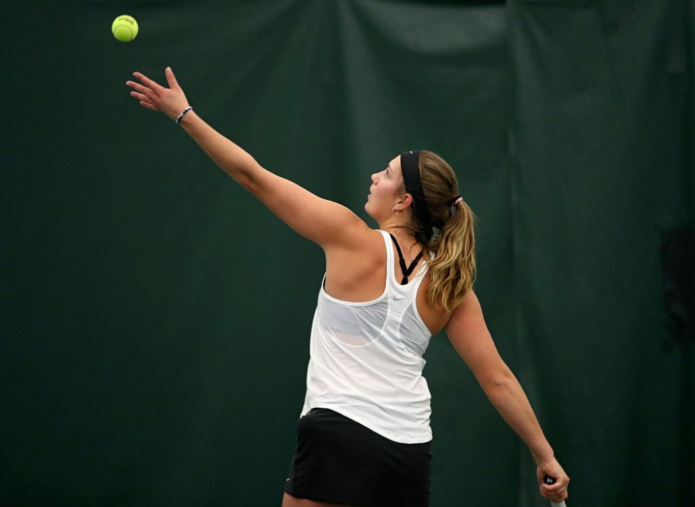 Iowa’s Ashleigh Jacobs serves during her singles match at the Hawkeye Tennis and Recreation Complex in Iowa City on Sunday, February 23, 2020. (Stephen Mally/hawkeyesports.com)