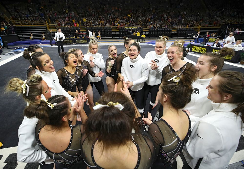 The Hawkeyes huddle after their meet at Carver-Hawkeye Arena in Iowa City on Sunday, March 8, 2020. (Stephen Mally/hawkeyesports.com)