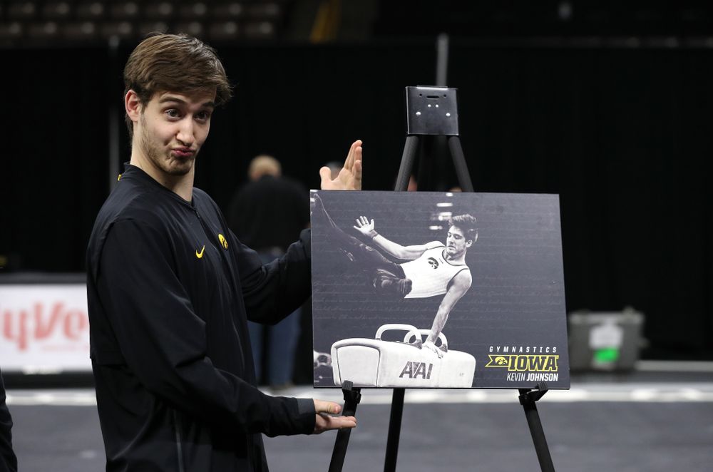 Iowa Men's Gymnast Kevin Johnson and his family during senior day ceremonies following their meet against the Ohio State Buckeyes  Saturday, March 16, 2019 at Carver-Hawkeye Arena.  (Brian Ray/hawkeyesports.com)