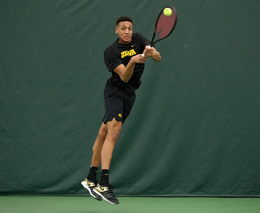 Iowa’s Oliver Okonkwo returns a shot during his doubles match at the Hawkeye Tennis and Recreation Complex in Iowa City on Friday, February 14, 2020. (Stephen Mally/hawkeyesports.com)