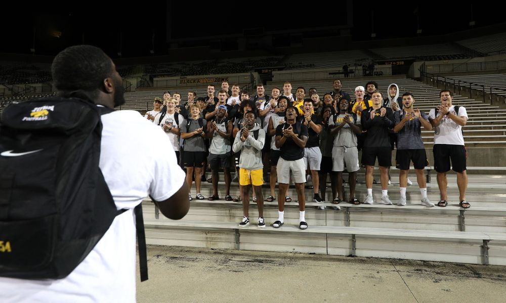 Iowa Hawkeyes defensive tackle Daviyon Nixon (54) leads the new players in a second rendition of the ÒFight SongÓ  Thursday, August 22, 2019 at Kinnick Stadium in Iowa City. (Brian Ray/hawkeyesports.com)
