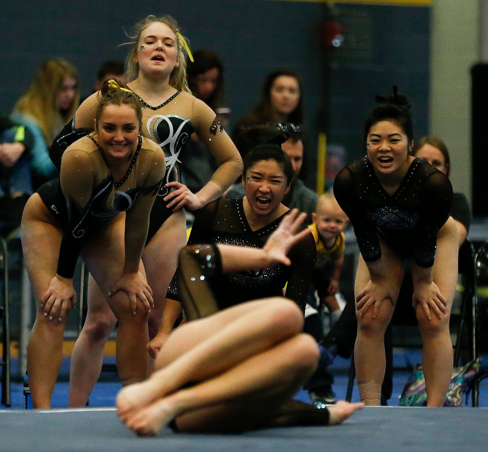 Iowa gymnasts react during Melissa Zurawski's floor routine during the Black and Gold Intrasquad meet at the Field House on 12/2/17. (Tork Mason/hawkeyesports.com)