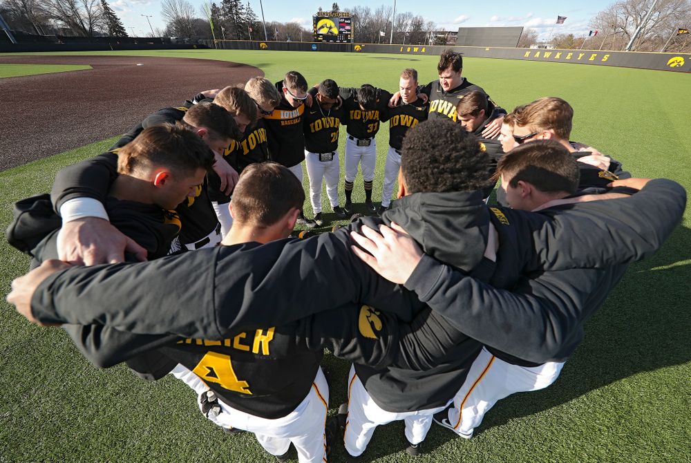 The Hawkeyes huddle before their game at Duane Banks Field in Iowa City on Tuesday, March 3, 2020. (Stephen Mally/hawkeyesports.com)