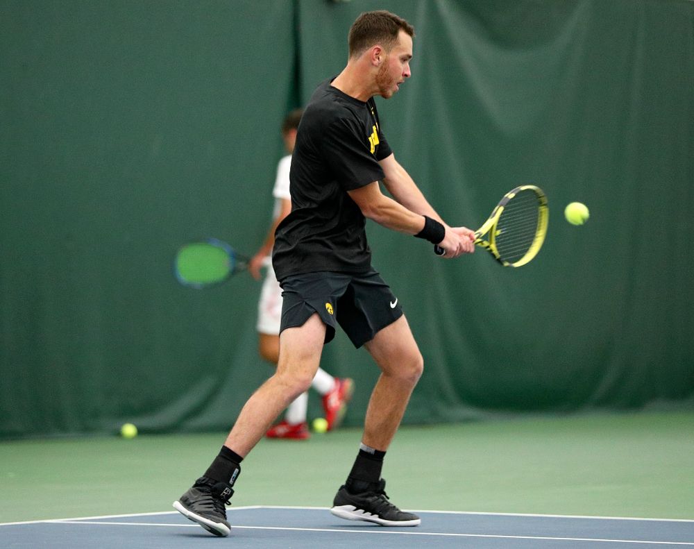 Iowa’s Kareem Allaf returns a shot during their match at the Hawkeye Tennis and Recreation Complex in Iowa City on Thursday, January 16, 2020. (Stephen Mally/hawkeyesports.com)