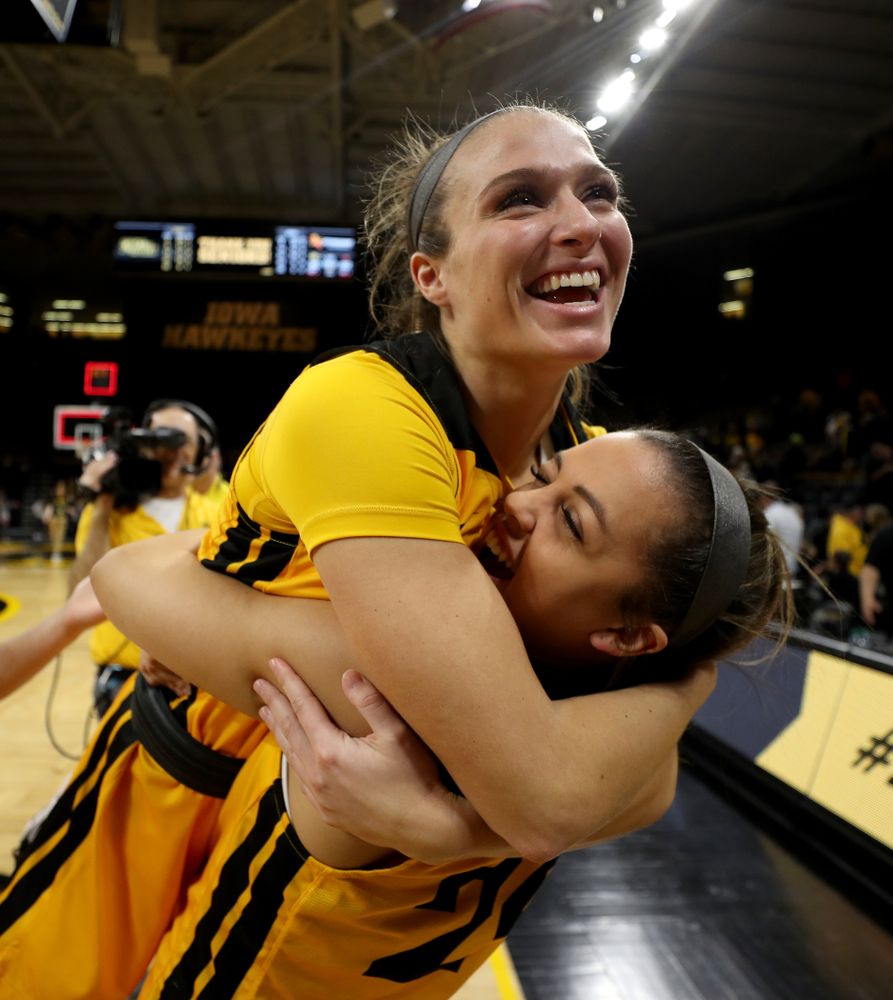 Iowa Hawkeyes guard Makenzie Meyer (3) hugs guard Gabbie Marshall (24) during senior day activities following their win over the Minnesota Golden Gophers Thursday, February 27, 2020 at Carver-Hawkeye Arena. (Brian Ray/hawkeyesports.com)
