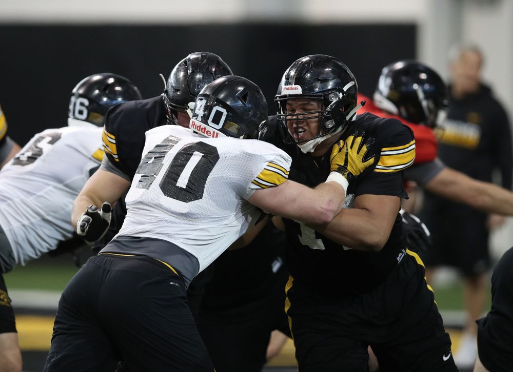 Iowa Hawkeyes offensive lineman Alaric Jackson (77) and defensive end Parker Hesse (40) during preparation for the 2019 Outback Bowl Monday, December 17, 2018 at the Hansen Football Performance Center. (Brian Ray/hawkeyesports.com)