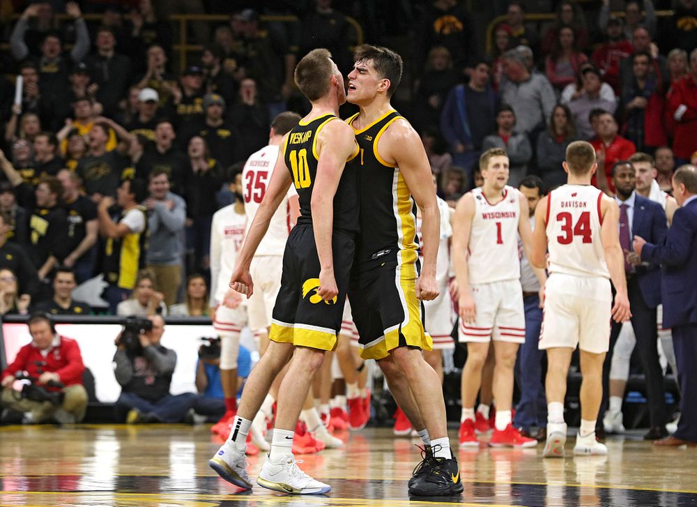 Iowa Hawkeyes guard Joe Wieskamp (10) and center Luka Garza (55) celebrate as they walk back to the bench for a timeout during the second half of their game at Carver-Hawkeye Arena in Iowa City on Monday, January 27, 2020. (Stephen Mally/hawkeyesports.com)