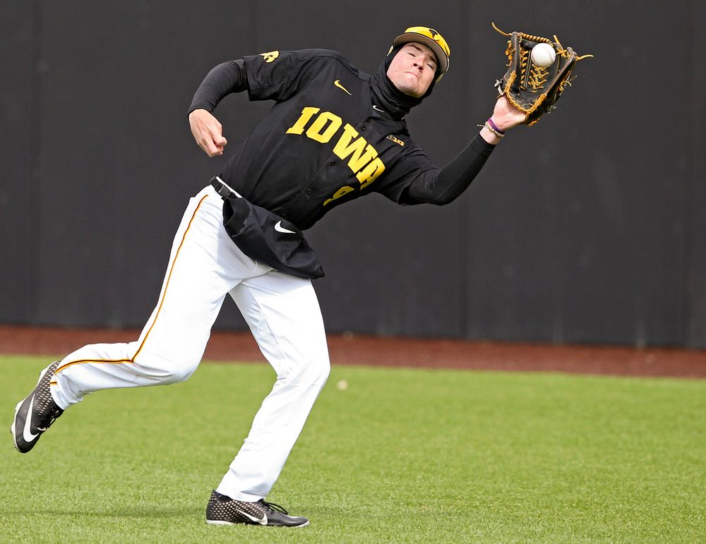 Iowa Hawkeyes right fielder Ben Norman (9) pulls in a fly ball for an out during the second inning of their game against Illinois at Duane Banks Field in Iowa City on Saturday, Mar. 30, 2019. (Stephen Mally/hawkeyesports.com)