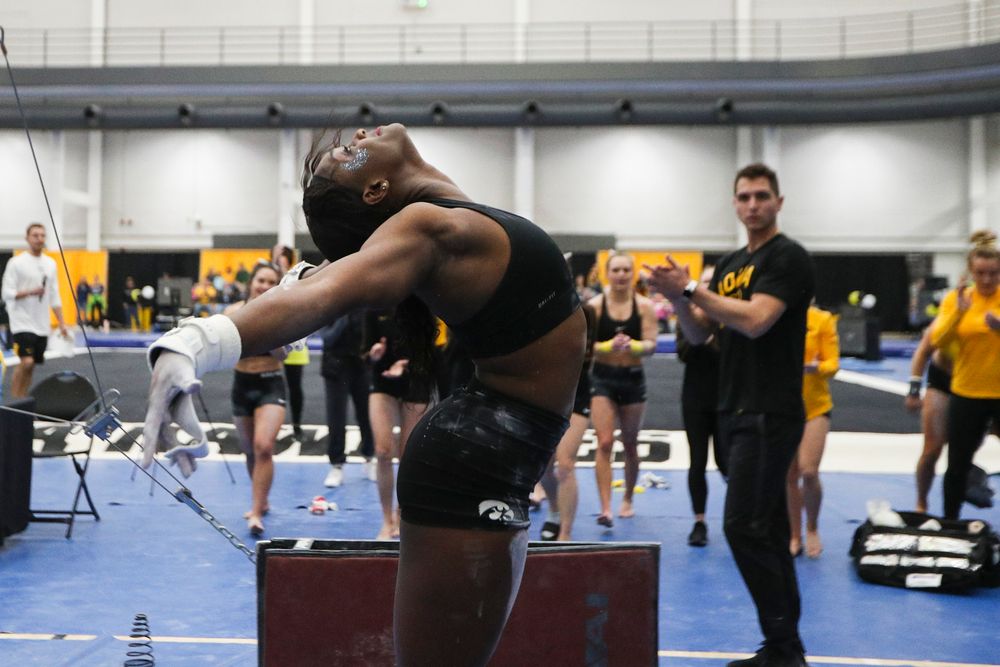 Jerquavia Henderson dismounts from the uneven bars during the Iowa women’s gymnastics Black and Gold Intraquad Meet on Saturday, December 7, 2019 at the UI Field House. (Lily Smith/hawkeyesports.com)
