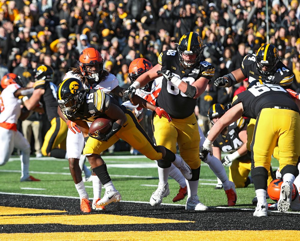 Iowa Hawkeyes running back Tyler Goodson (15) scores a touchdown during the first quarter of their game at Kinnick Stadium in Iowa City on Saturday, Nov 23, 2019. (Stephen Mally/hawkeyesports.com)