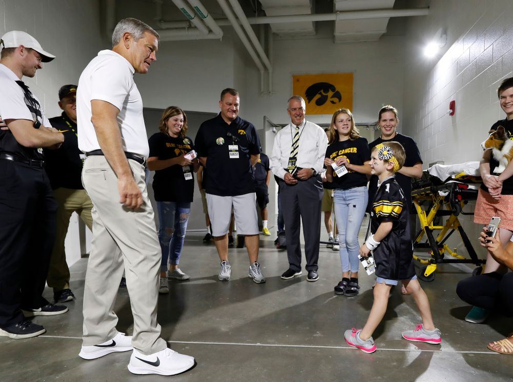 Iowa Hawkeyes head coach Kirk Ferentz  talks with Kid  Captain Harper Stribe and her family before the Hawkeyes game against the Iowa State Cyclones Saturday, September 8, 2018 at Kinnick Stadium. (Brian Ray/hawkeyesports.com)