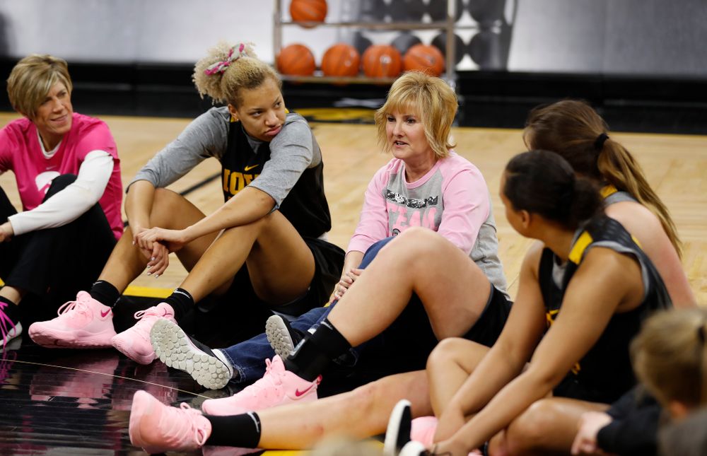 Cancer survivors tell their stories to the Iowa Women's Basketball team following their shoot around  