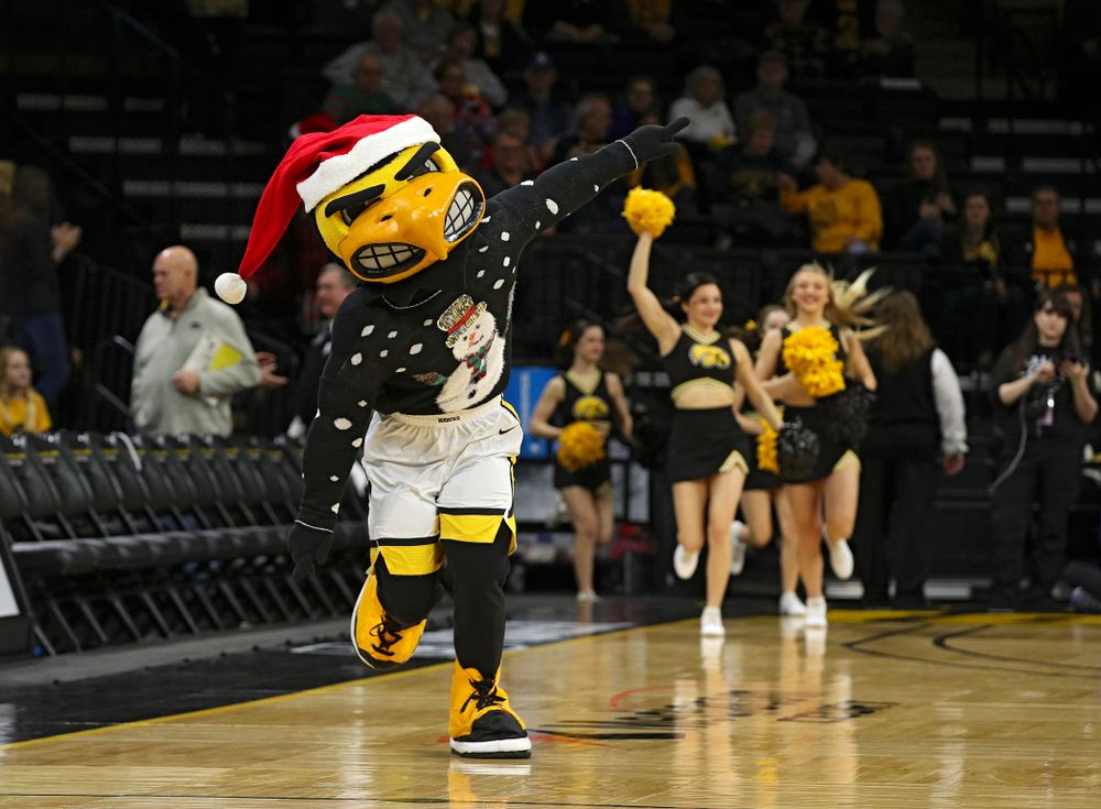 Herky runs onto the court before their game at Carver-Hawkeye Arena in Iowa City on Saturday, December 21, 2019. (Stephen Mally/hawkeyesports.com)