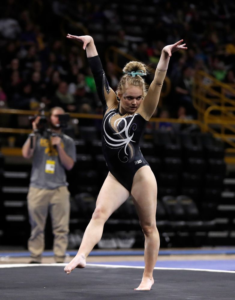 Iowa's Charlotte Sullivan competes on the floor against the Nebraska Cornhuskers 