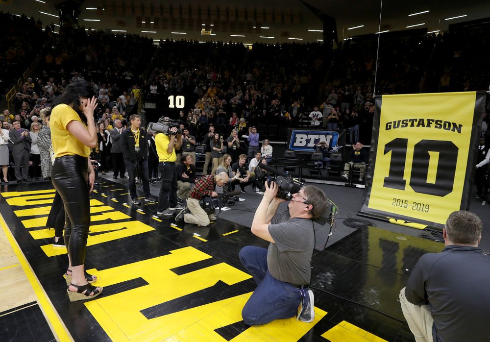 Megan Gustafson wipes away a tear as her number is raised into the rafters during a jersey retirement ceremony Sunday, January 26, 2020 at Carver-Hawkeye Arena. (Brian Ray/hawkeyesports.com)