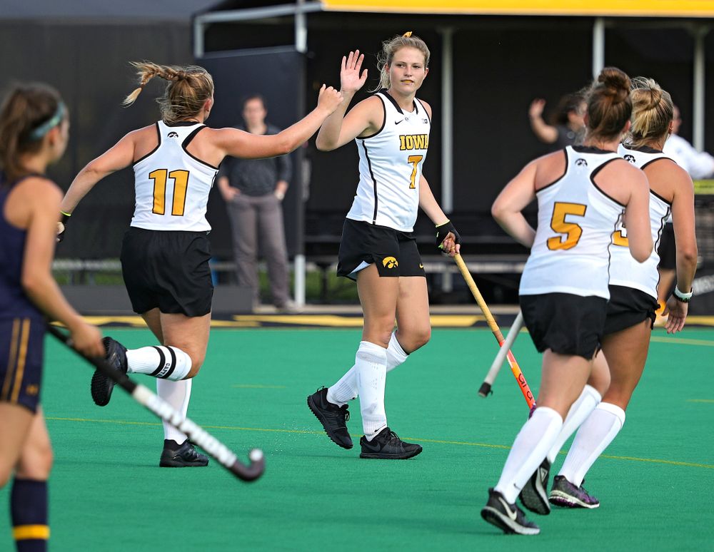 Iowa’s Katie Birch (11) gets a high five from Ellie Holley (7) after scoring a goal during the fourth quarter of their game at Grant Field in Iowa City on Friday, Sep 13, 2019. (Stephen Mally/hawkeyesports.com)