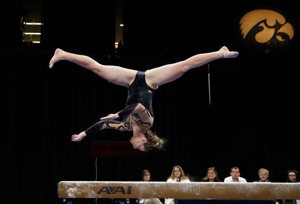 Iowa's Sydney Hogan competes on the beam