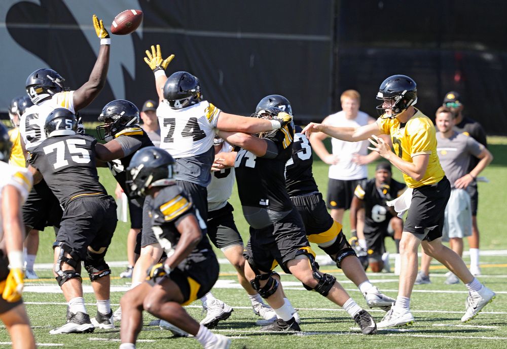 Iowa Hawkeyes defensive tackle Daviyon Nixon (54) tips a pass by quarterback Spencer Petras (7) during Fall Camp Practice No. 13 at the Hansen Football Performance Center in Iowa City on Friday, Aug 16, 2019. (Stephen Mally/hawkeyesports.com)