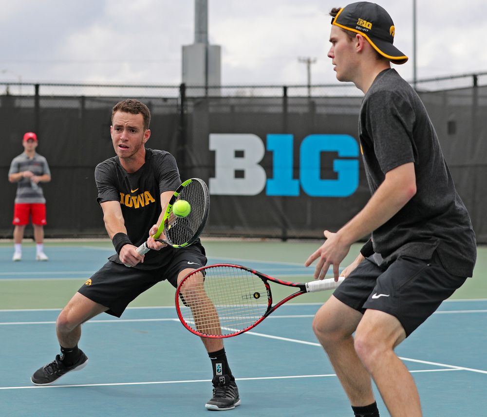 Iowa's Kareem Allaf (from left) returns a shot as Jonas Larsen looks on during a double match against Ohio State at the Hawkeye Tennis and Recreation Complex in Iowa City on Sunday, Apr. 7, 2019. (Stephen Mally/hawkeyesports.com)