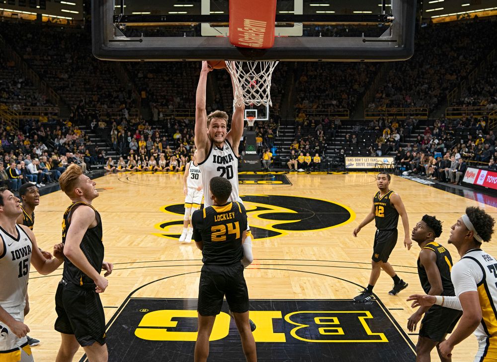 Iowa Hawkeyes forward Riley Till (20) is fouled as he tries to dunk over Kennesaw State Owls forward Bryson Lockley (24) during the second half of their their game at Carver-Hawkeye Arena in Iowa City on Sunday, December 29, 2019. (Stephen Mally/hawkeyesports.com)