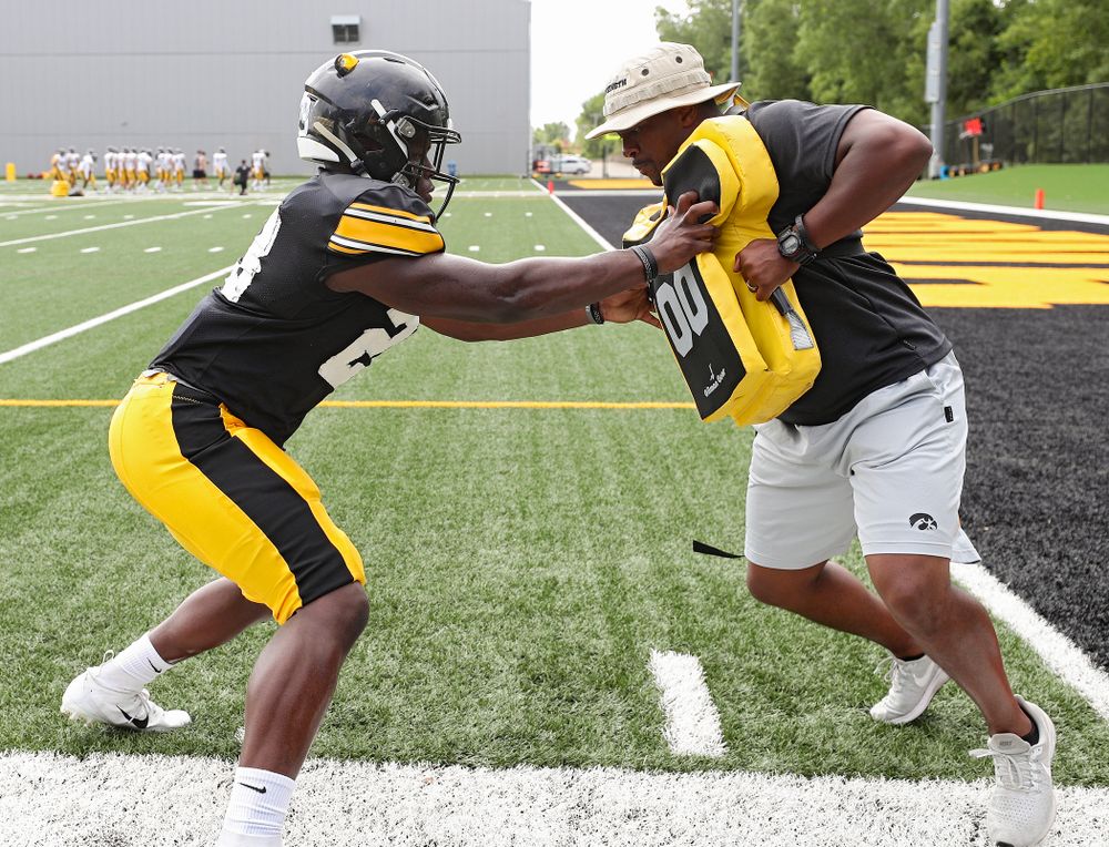Iowa Hawkeyes running back Shadrick Byrd (23) runs a drill with running backs coach Derrick Foster during Fall Camp Practice No. 10 at the Hansen Football Performance Center in Iowa City on Tuesday, Aug 13, 2019. (Stephen Mally/hawkeyesports.com)