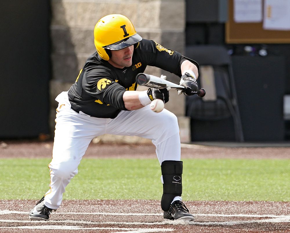 Iowa Hawkeyes designated hitter Chris Whelan (28) lays down a sacrifice bunt during the second inning of their game against Illinois at Duane Banks Field in Iowa City on Saturday, Mar. 30, 2019. (Stephen Mally/hawkeyesports.com)