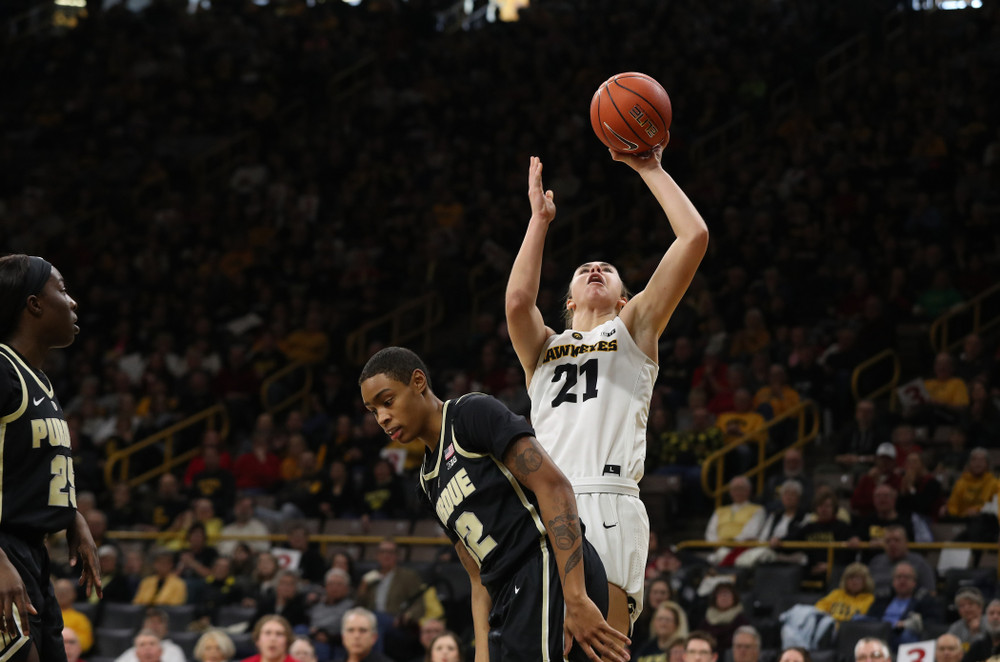 Iowa Hawkeyes forward Hannah Stewart (21) makes a basket and draws a foul against the Purdue Boilermakers Sunday, January 27, 2019 at Carver-Hawkeye Arena. (Brian Ray/hawkeyesports.com)