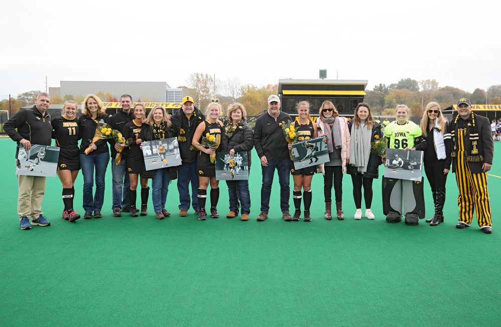 Iowa’s Katie Birch (11), Isabella Solaroli (16), Ryley Miller (19), Sophie Sunderland (20), Leslie Speight (96) are honored on the field with their family for Senior Day before their game at Grant Field in Iowa City on Saturday, Oct 26, 2019. (Stephen Mally/hawkeyesports.com)