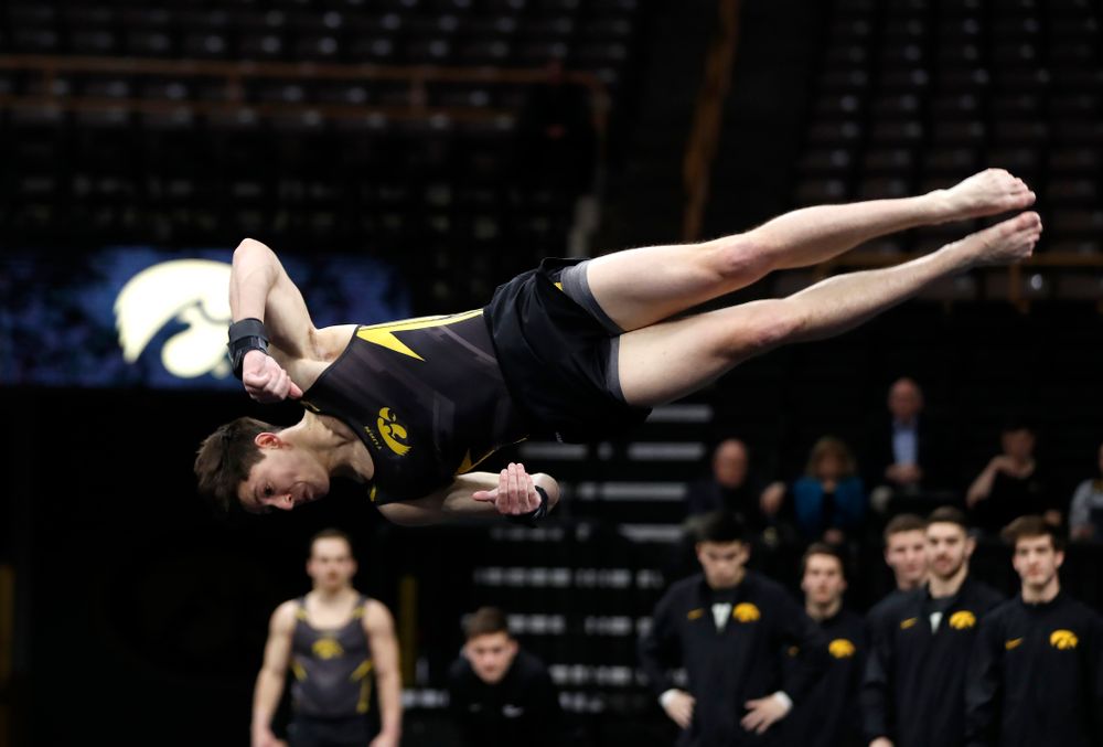 Mark Springett competes on the floor against Minnesota and Air Force 
