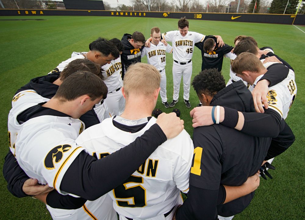 The Hawkeyes huddle before their college baseball game at Duane Banks Field in Iowa City on Wednesday, March 11, 2020. (Stephen Mally/hawkeyesports.com)