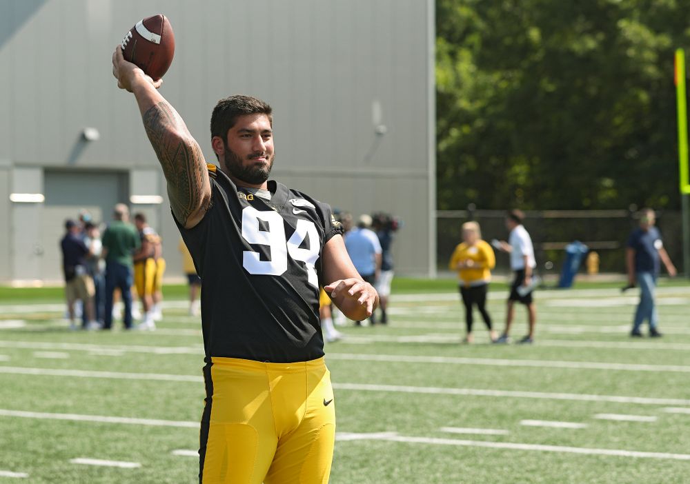 Iowa Hawkeyes defensive end A.J. Epenesa (94) throws a football during Iowa Football Media Day at the Hansen Football Performance Center in Iowa City on Friday, Aug 9, 2019. (Stephen Mally/hawkeyesports.com)