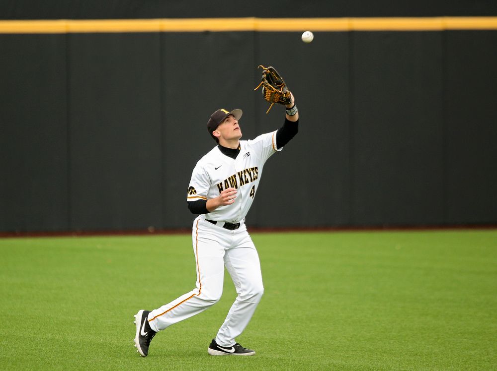 Iowa left fielder Brayden Frazier (4) pulls in a fly ball for an out during the fifth inning of their college baseball game at Duane Banks Field in Iowa City on Wednesday, March 11, 2020. (Stephen Mally/hawkeyesports.com)