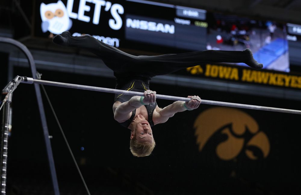 Iowa's Nick Merryman competes on the high bar against the Ohio State Buckeyes Saturday, March 16, 2019 at Carver-Hawkeye Arena.  (Brian Ray/hawkeyesports.com)