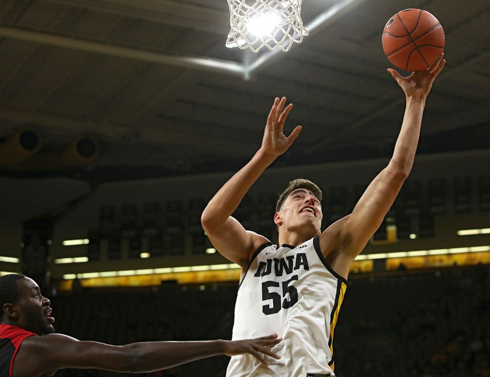 Iowa Hawkeyes center Luka Garza (55) puts up a shot during the first half of their game at Carver-Hawkeye Arena in Iowa City on Friday, Nov 8, 2019. (Stephen Mally/hawkeyesports.com)