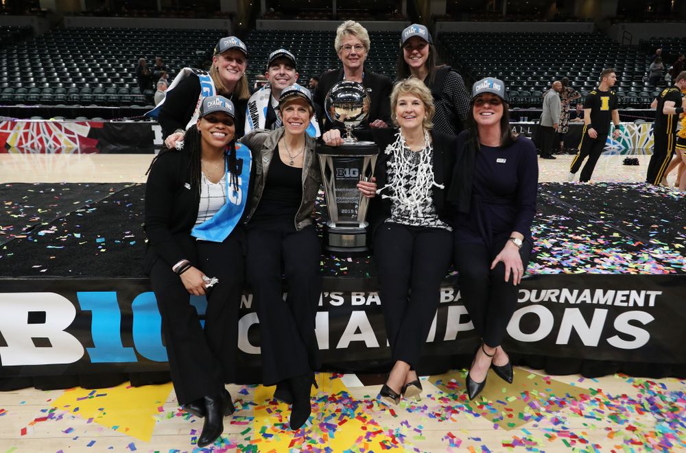 The Iowa Women's Basketball Coaching Staff with deputy athletics director Barbara Burke against the Maryland Terrapins Sunday, March 10, 2019 at Bankers Life Fieldhouse in Indianapolis, Ind. (Brian Ray/hawkeyesports.com)
