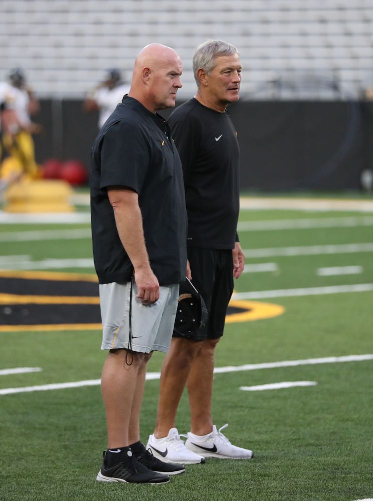Iowa Hawkeyes head coach Kirk Ferentz with  strength and conditioning coordinator Chris Doyle 